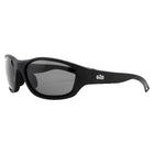 Gill 9475 Classic solbrille sort set fra siden med sollys i baggrunden